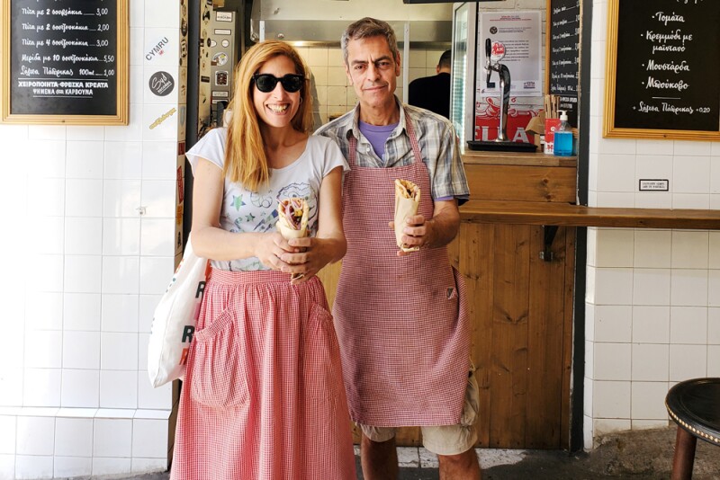 Carolina Doriti, the Athens director of Culinary Backstreets, stands with Tasos Perdikis, owner of Volvi, a souvlaki place in the Varvakeios Market.