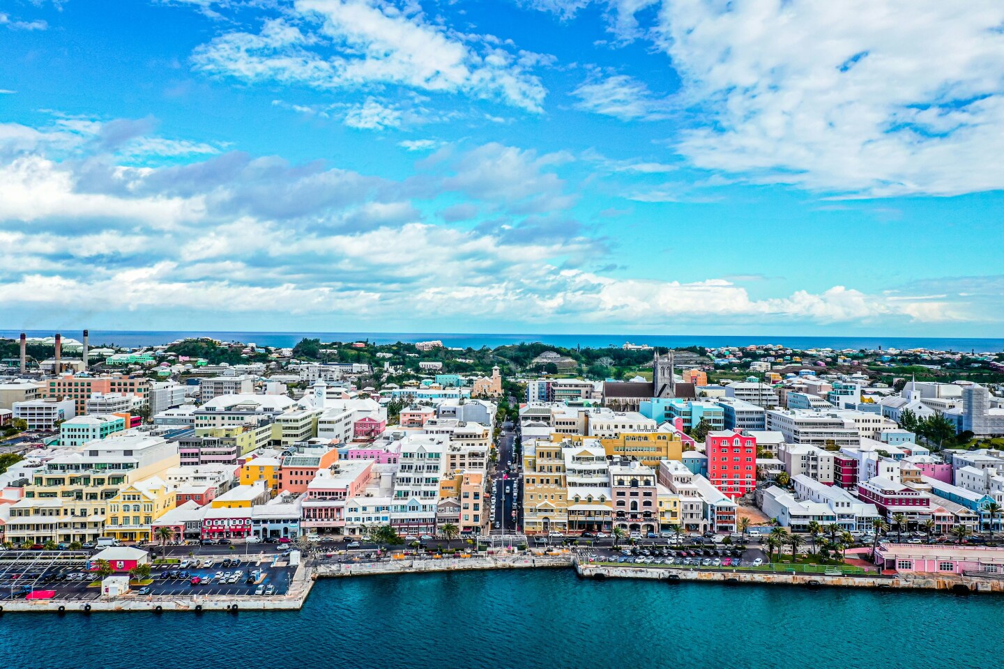 Aerial view of Bermuda with colorful buildings lining the shore