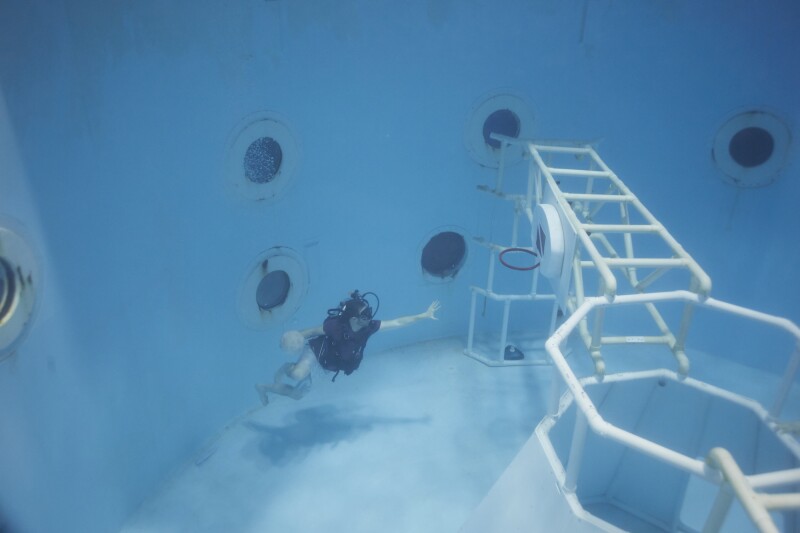 A training tank allows campers to experience what it would be like to work (or play basketball) while weightless.