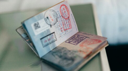 The visa pages of a passport full of stamps