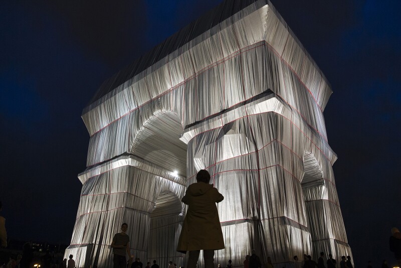 Visitors are allowed to touch the silver and blue fabric—as the artists had intended.