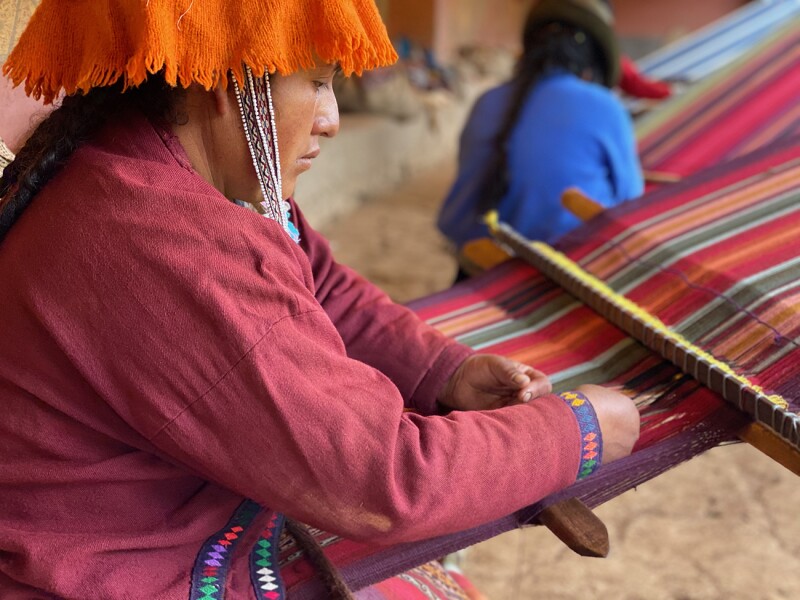 Buying a locally made souvenir—such as a bracelet from the Chawaytire weaving collective in Peru—is one way to support local communities.