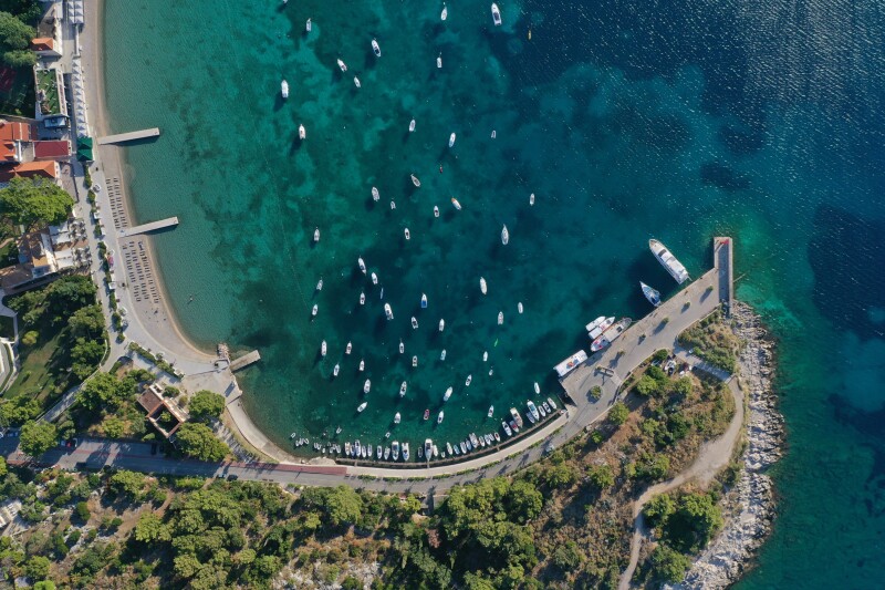Aerial view of the bay and beach of Srebreno near Dubrovnik, with numerous small boats