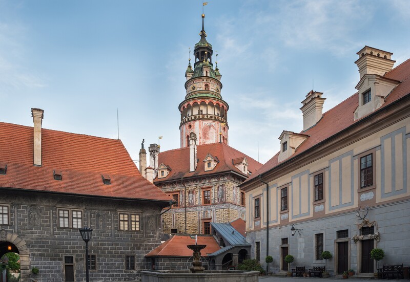Exterior of massive castle complex in South Bohemia, with high, round belfry in center