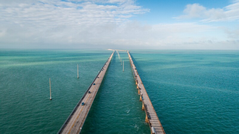 Aerial view of the Seven Mile Bridge extending out over the ocean to the lower Florida Keys.