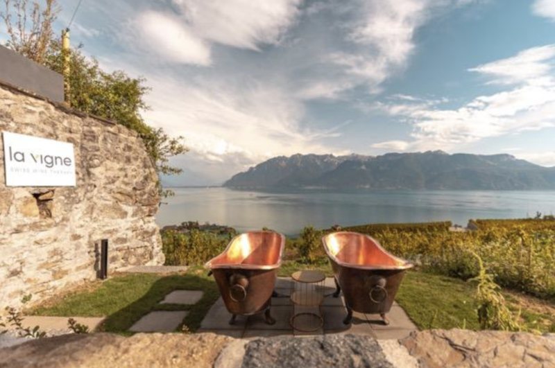 At La Vigne, copper tubs overlook the Lavaux vineyards and Lake Geneva.