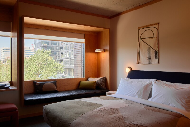 Guest room, with built-in seating under large window