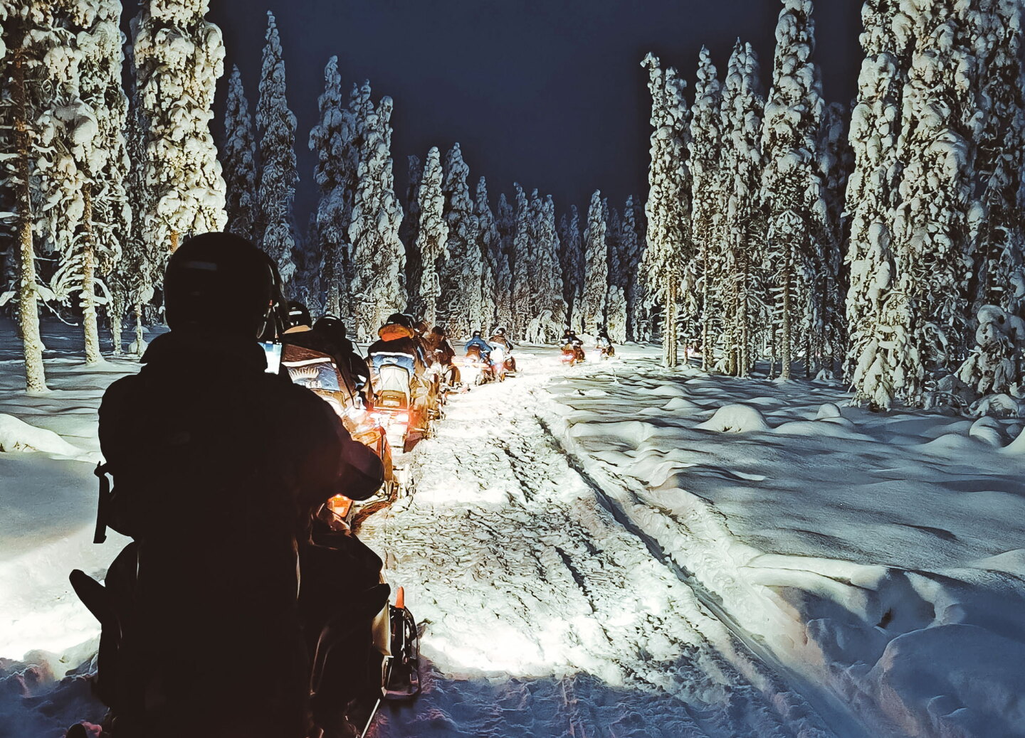 Snowmobile Rear View 6 Spas With Amazing Views of the Northern Lights - AFAR