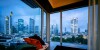 A view at dusk of Frankfurt’s banking district from large windows inside Hilton Frankfurt City Centre room.