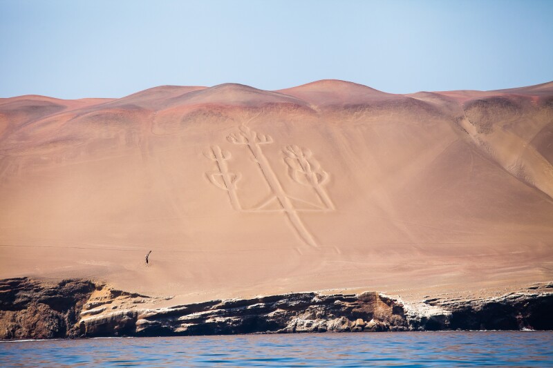 Ancient geoglyphs created by members of the Nazca civilization can be seen along a stretch of coastal desert in southern Peru that includes the Paracas National Reserve.
