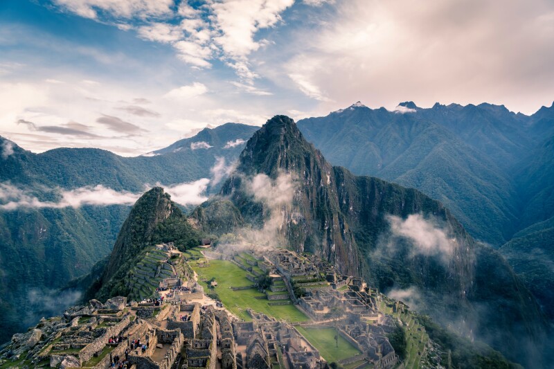 Machu Picchu in Peru with some scattered clouds