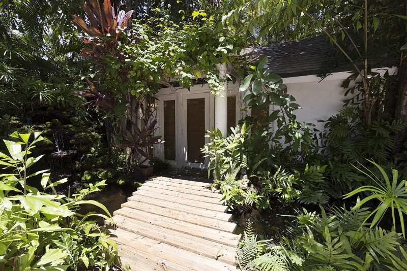 Lush landscaping surrounds this private cottage escape in Miami’s popular Coconut Grove neighborhood.