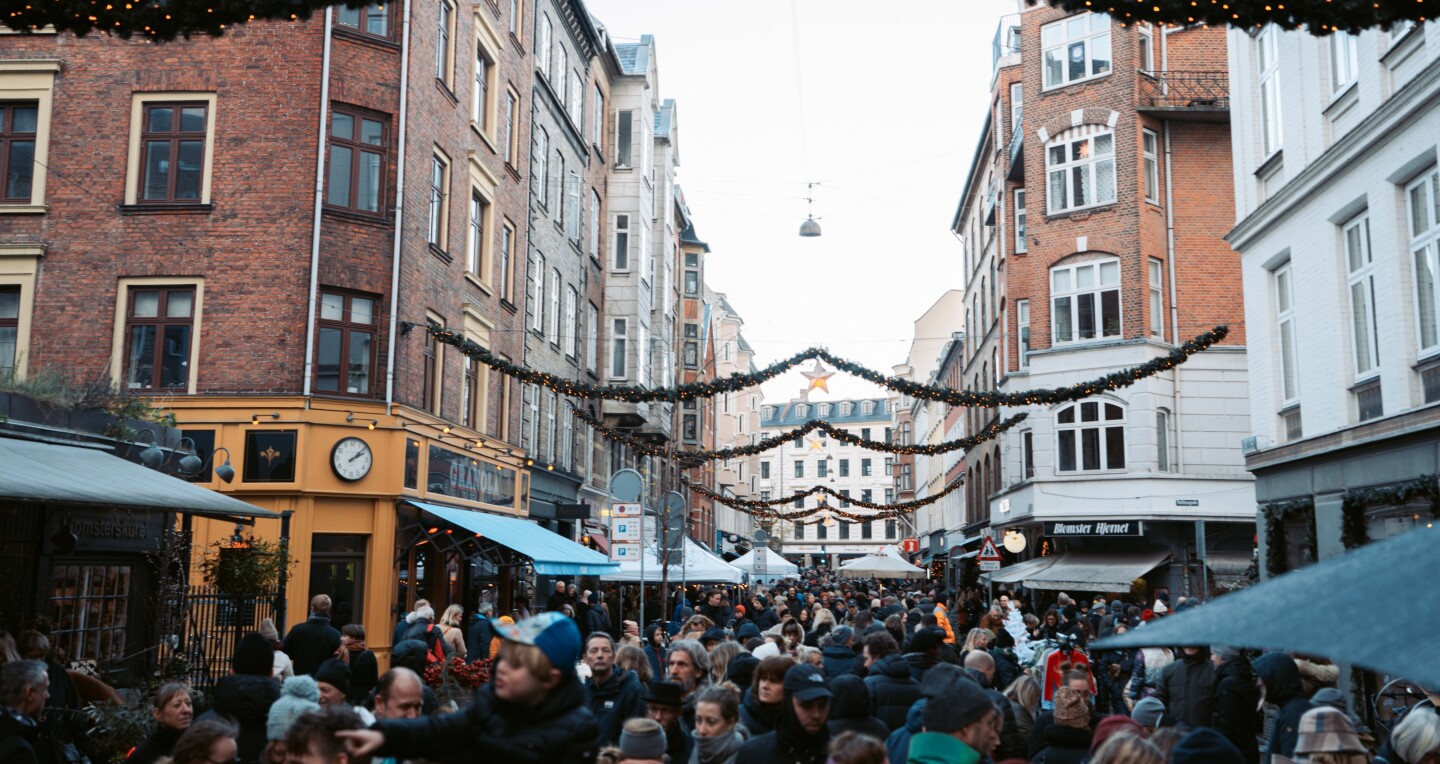 The streets crowded with people at the Værnedamsvej and Tullinsgade Christmas Market in Copenhagen, Denmark