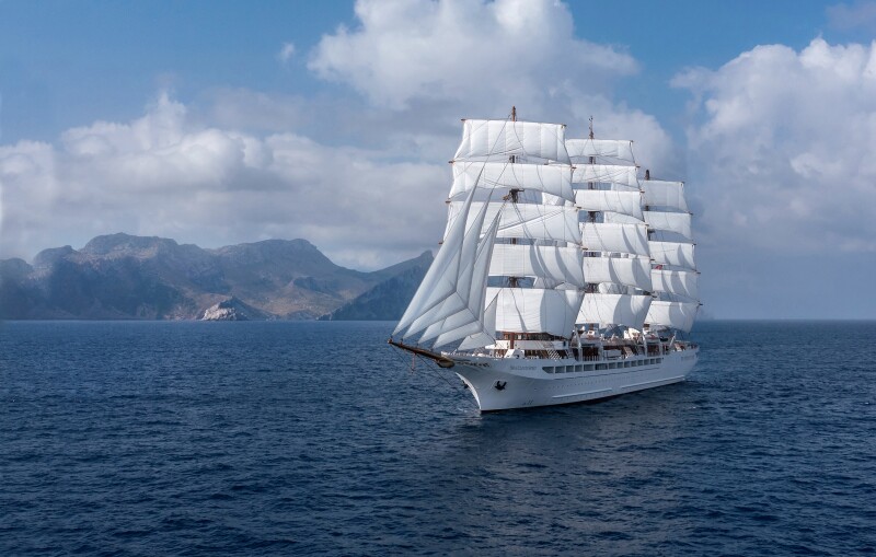 An exterior image of the 'Sea Cloud Spirit' vessel sailing on clear blue water