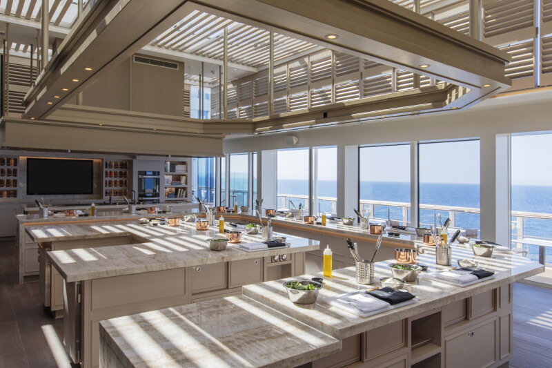 Silversea Cruises S.A.L.T. Lab cooking class space with no people and wall of windows overlooking water