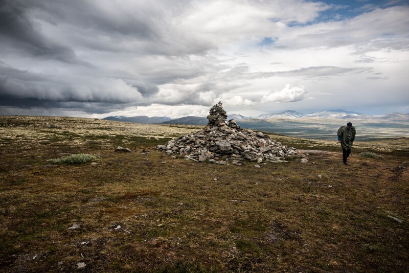 Set an intention of self-improvement at the 10-foot cairn in Dovrefjell National Park by adding a stone.