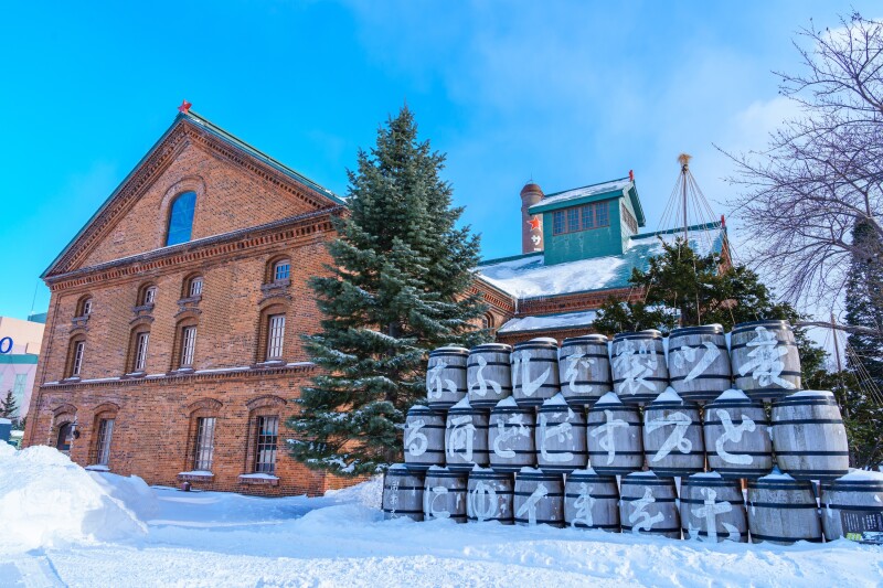 Brick building near barrels