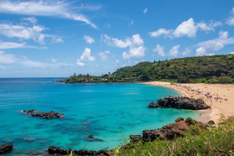 Watch surfers take on 30-foot waves at Waimea Bay.