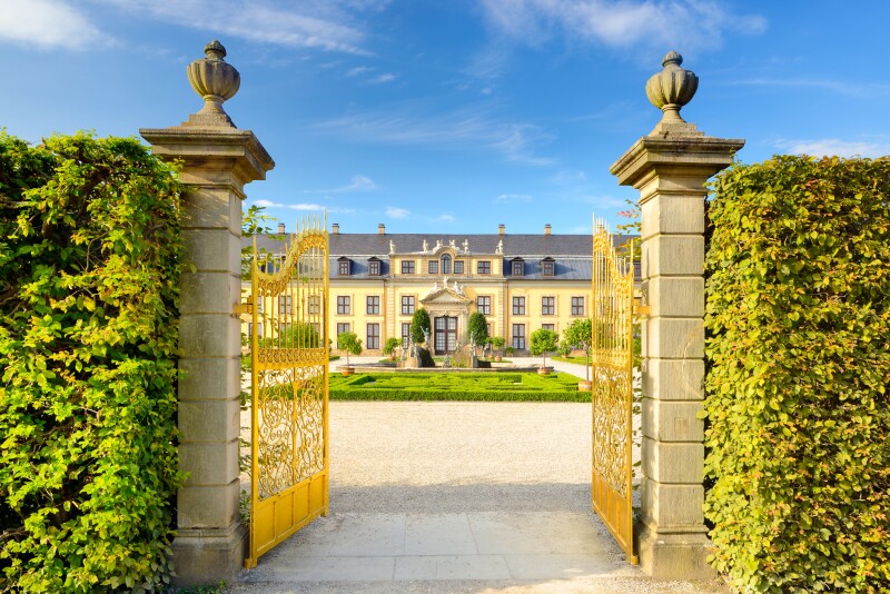 The golden gates opening into the Royal Gardens and palace of Herrenhausen in Hannover, Germany