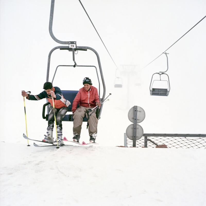OUKAIMEDEN, MOROCCO FEB 2014 Young Berber locals get off the lift at the top of Oukaimeden ski hill and get ready to enjoy the late season powder.
