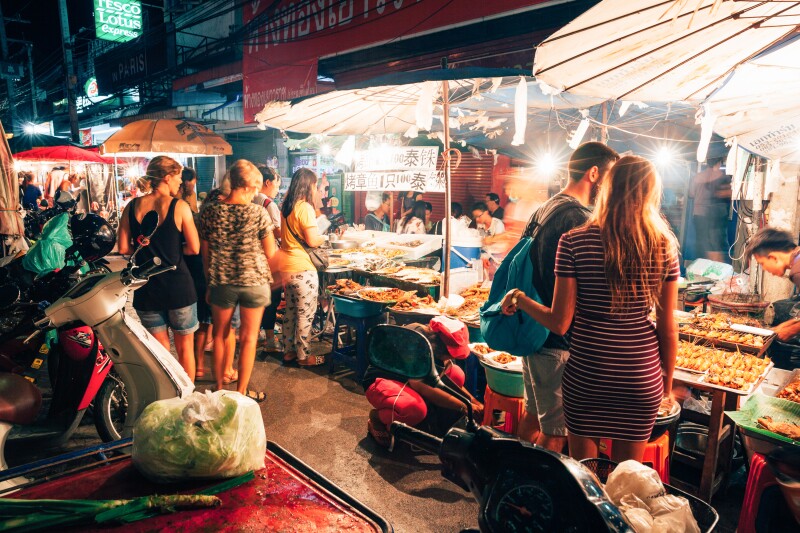 Tourists at nighttime Chiang Mai Market food stalls