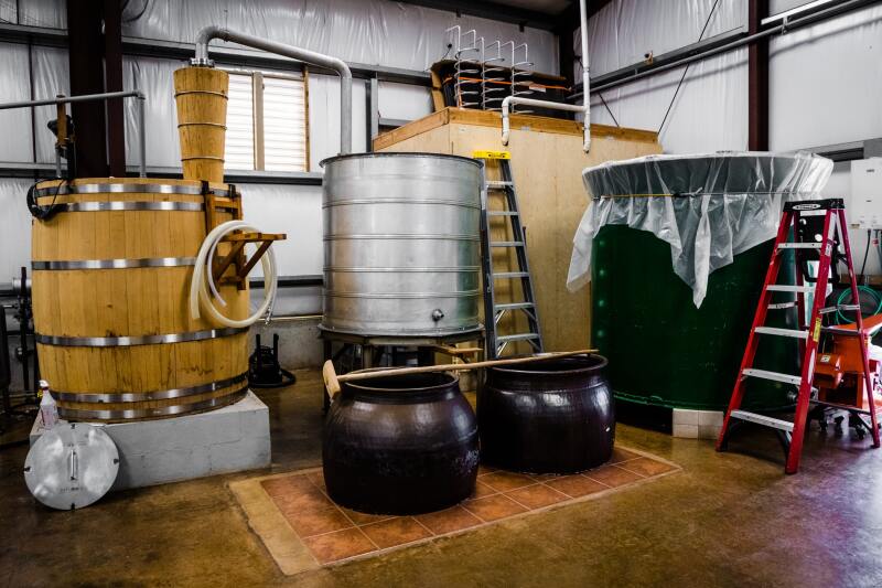 Fifteen to twenty thousand pounds of sweet potatoes move through the traditional Japanese still for each shōchū batch.