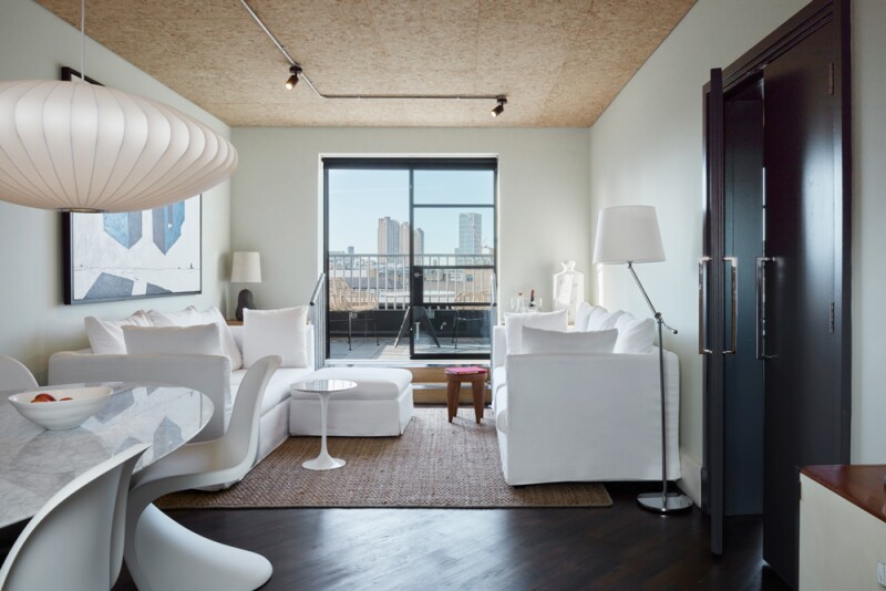 Interior of guest room with white furniture