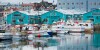 Reykjavik Iceland Arctic downtown Harbor marina colorful small fishing boats and reflections in water at port.