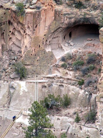 Steep cliff dwellings connected by steep ladders at Alcove House cliff dwelling at Bandelier National Monument