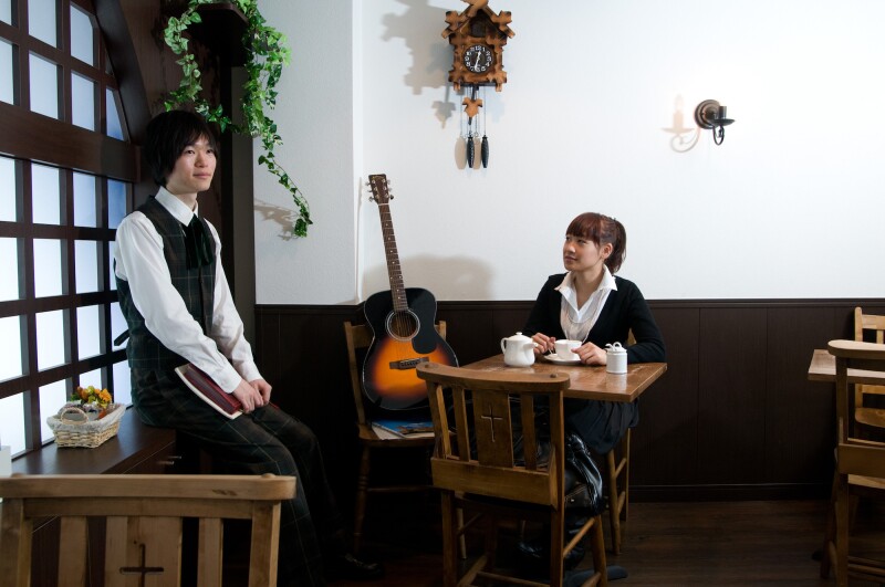 JAPAN / Tokyo / Akihabara "Akiba" 03/2009..Harajuku district : Edelstein cafe' : The Edelstein cafe' if for only girls who wants to be served and have a chat with some handsome boys who work there as waiter. The cafe' has a severe privacy policy and waiters are chosen among the best good looking boys/ The waiter near by a female customer which is looking at him. Daniele Mattioli / Anzenberger