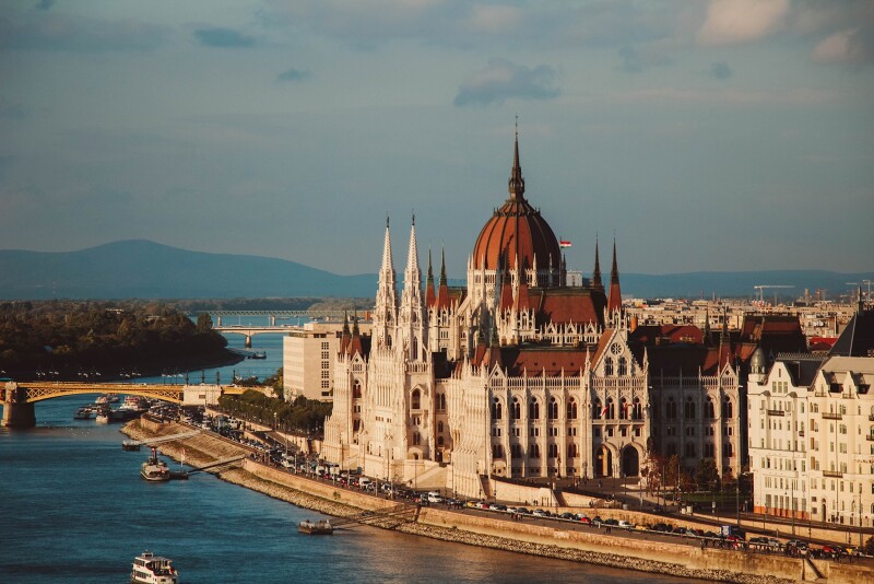 The River Danube bisects Hungary, a chain bridge connecting the hilly, western half of the city called Buda with the flat, eastern part called Pest.