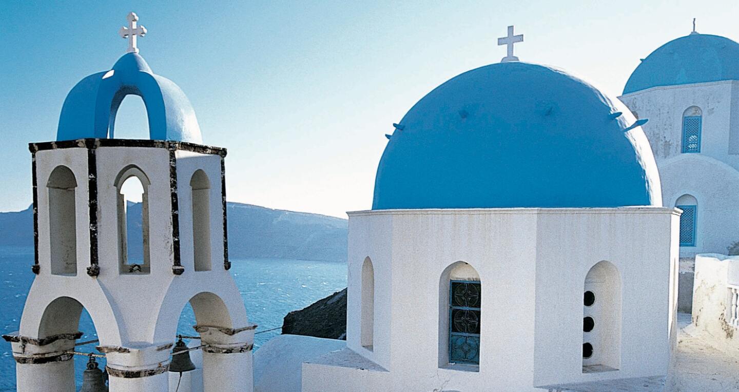 Blue roofed churches by the sea