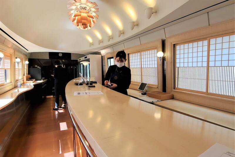 Travelers can purchase Japanese sake and snacks in the bar car.