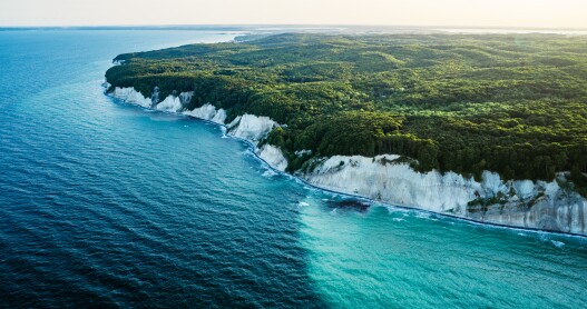 A birds-eye view of the Baltic Sea and cliffs of the Jasmund National Park on Rügen Island, Germany.