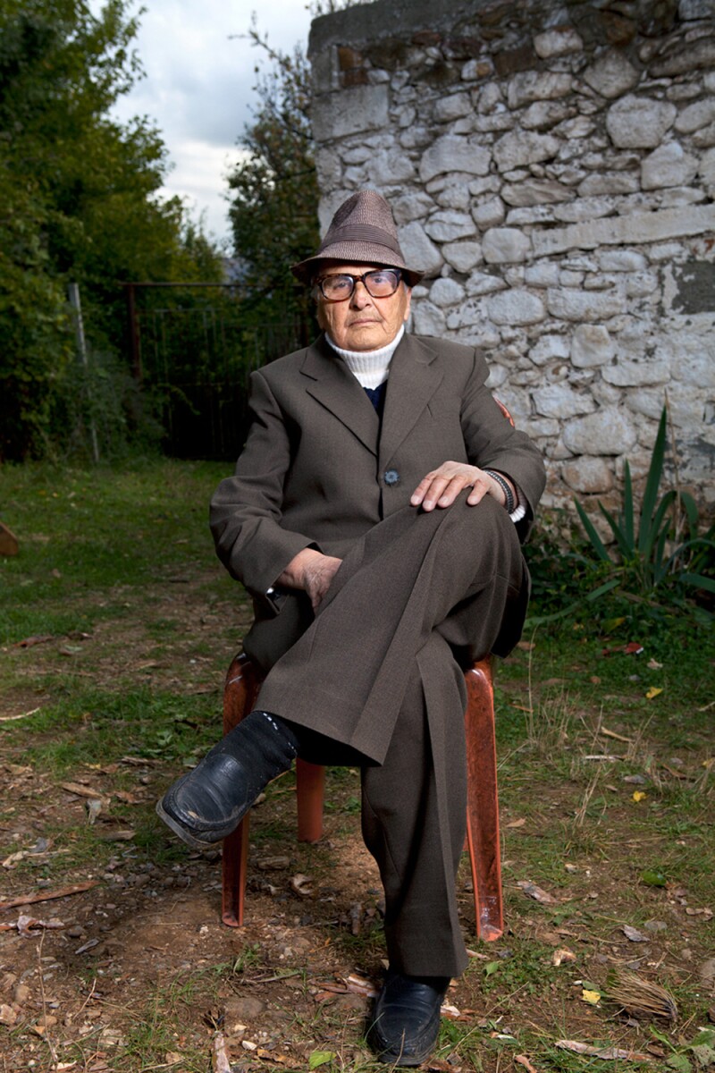 Hajdari became a burnesha to look after his deceased brother’s family. He chose for Peters to photograph him outside of his house to convey his honor and success.