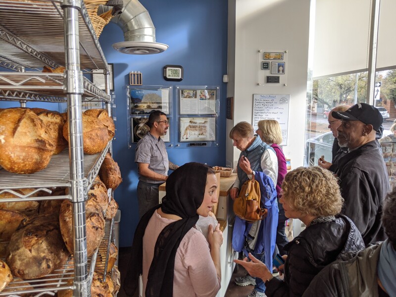 Customers select and pay for their bread at Barrio on Tuesday, February 11.