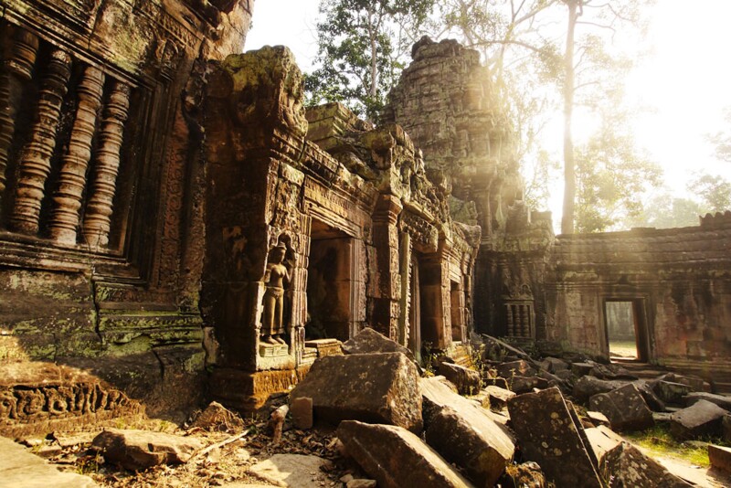 Sunlight peeking over an ancient rock formation