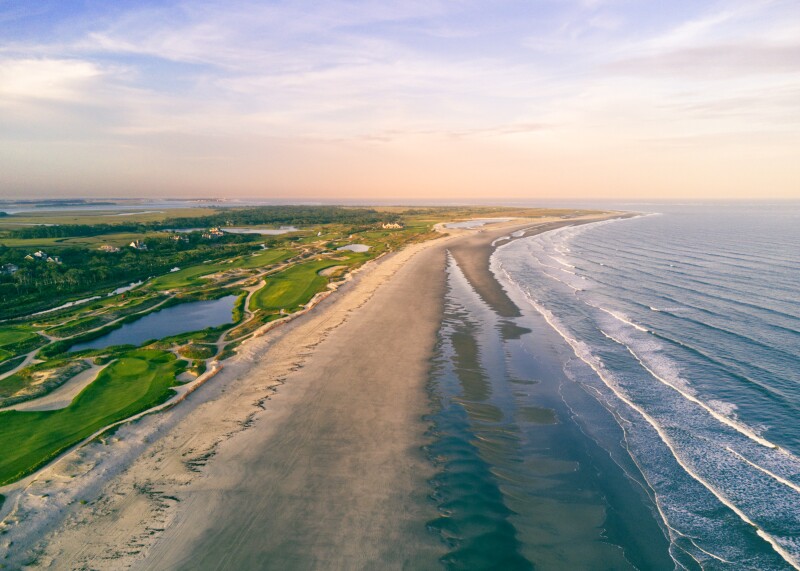A sunset over an ocean beach alongside a golf course sunset, taking this picture looking back at the Ocean Course on Kiawah Island, SC.
