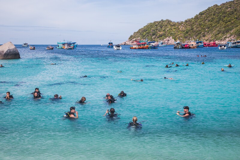 In the Gulf of Thailand, Koh Tao attracts swarms of scuba divers, who come for waters teeming with colorful fish, turtles, coral, and other marine life.