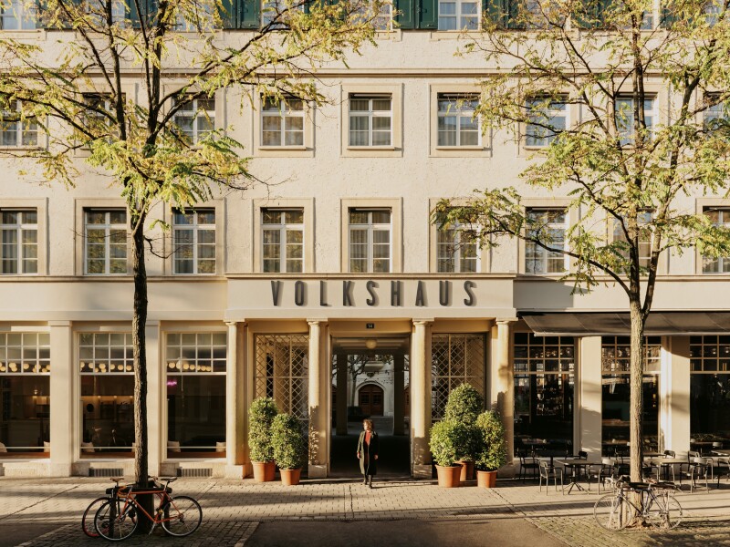 Cream building with the words "Volkshaus" written across