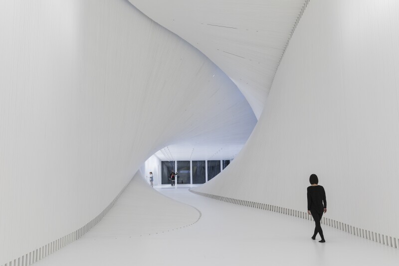 The Twist’s interior walls, floor, and ceiling are made from thin white wood lamellas.
