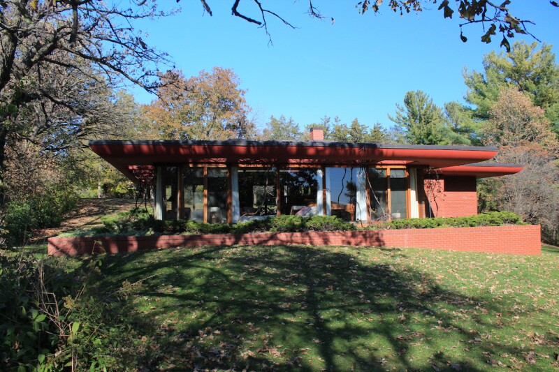 Cedar Rock house in the shade of a tree near the Wapsipinicon River