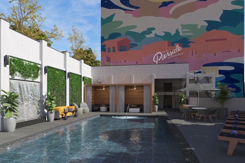 Hotel Pierside’s pool surrounded by modern decor, plant walls, and a colorful mural