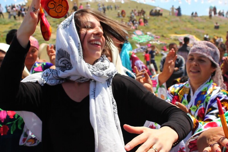 Mickela Mallozzi dancing on her travels