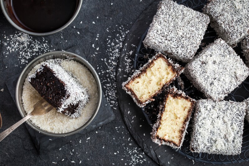 A lamington is a classic Australian cake made from squares of sponge cake coated in an outer layer of chocolate sauce and coconut.