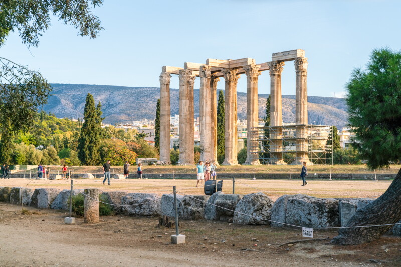 Six remaining columns of temple of Olympian Zeus, with a few people and trees nearby