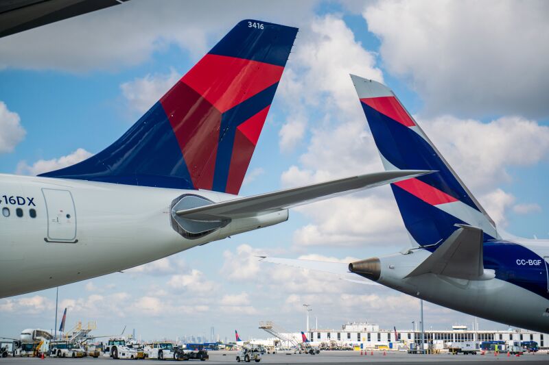 the tail of two Delta and Latam airplanes