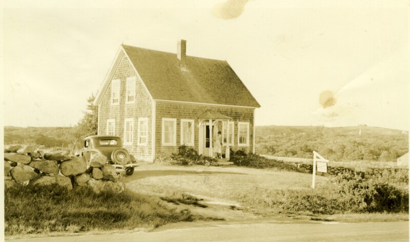 historic black and white photo of gray shingled house from the 1950s with an old-fashioned car parked outside. It is the house of Katie West who was the last “native speaker” of Martha’s Vineyard Sign Language.
