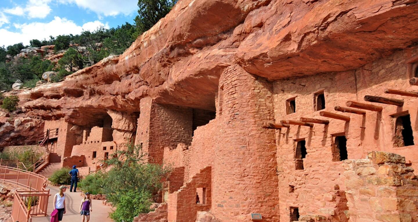 Clay buildings built into a cliff wall