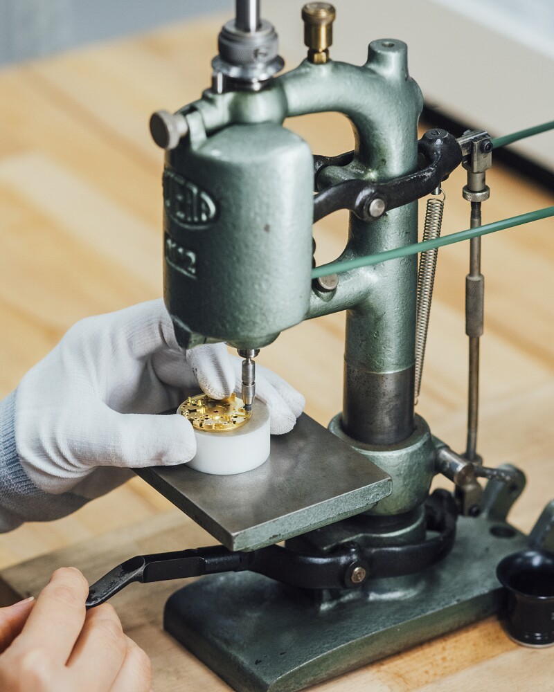 After passing through initial computerized construction, the watch-assembling process turns manual, where workers set stones and pins, engrave, and oil components of the piece.